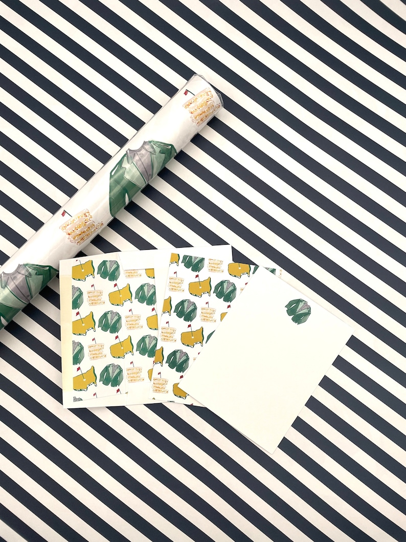 May include: A set of four gift tags featuring a green and yellow golf course design. The tags are printed on white cardstock and have a blank space for writing.