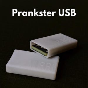 May include: Two white plastic USB drives, one with the USB connector exposed and the other with the connector hidden. The text "Prankster USB" is printed above the drives.