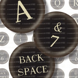 May include: A set of black and white round buttons with various letters, numbers, and symbols. The buttons have a glossy finish and are arranged in a random pattern. The text on the buttons includes the letters A, Q, R, Z, I, & and the numbers 7, 6, 9, 4. The buttons also include the words "BACK" and "SPACE".