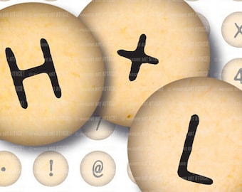 May include: Close-up of three beige, circular objects with the letters H, +, and L in black. Other circular objects with letters and symbols are in the background. The text "MASSIVE ART ATTACK!" is visible on the objects.