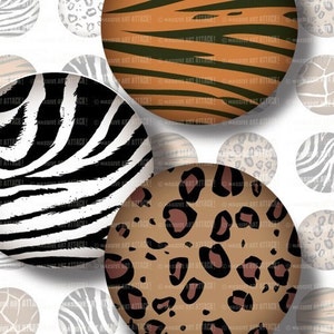 May include: A collection of circular designs featuring animal print patterns. The designs include zebra stripes in black and white, tiger stripes in orange and black, and leopard spots in brown and black. The text "MASSIVE ART ATTACK!" is visible on some circles.