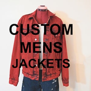 May include: A scarlet red denim jacket with the text "CUSTOM MENS JACKETS" in large black letters. The jacket is displayed on a mannequin with a white shirt underneath and blue denim shorts.