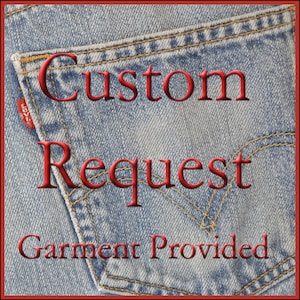 May include: A close-up of a blue denim pocket with the words "Custom Request Garment Provided" in red text.