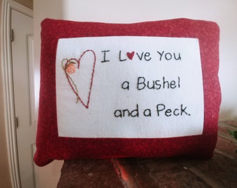 Valentine Pillow with the saying "I Love you a Bushel and a Peck."