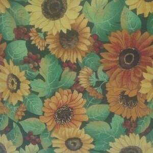 May include: A green and brown throw pillow with a floral pattern featuring sunflowers and leaves.