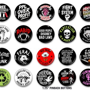 May include: A collection of 1.25-inch pinback buttons with various designs and slogans. The buttons feature text like "Free Information," "PPL Over Profit," and "Kindness is Punk." The color palette includes black, white, red, and green.