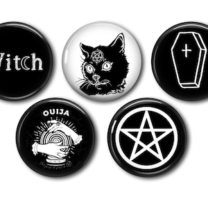 May include: Set of five black and white round buttons with occult and witchy designs. Includes a button with the word "Witch", a black cat with a pentagram, a coffin, a Ouija board, and a pentagram symbol.