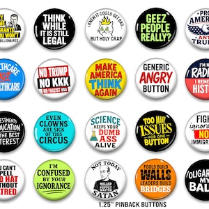 May include: A collection of twenty round 1.25-inch pinback buttons featuring various political and social slogans in different colors and fonts. The buttons display text such as 'They blame immigrants', 'Think while it is still legal', 'Make America think again', and 'Fools build walls'.