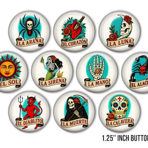 May include: Ten round buttons, each 3.18 cm in diameter, featuring tattoo-style designs. Illustrations include a spider, heart with a dagger, skull, sun, mermaid, hand, scorpion, devil, Grim Reaper, and sugar skull. Each button has text.