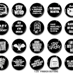 May include: A set of twenty black pinback buttons, each 3.18 cm in diameter, with white text and gothic imagery. The buttons display phrases such as "Dark and Stormy" and "I Hate It When My Blacks Don't Match", alongside illustrations of bats and tombstones.