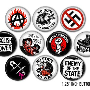 May include: A set of ten buttons, each 3.18 cm in diameter, featuring bold graphic designs and text. Designs include an anarchy symbol, a rat, a crossed-out swastika, and the phrases "Abolish Power" and "Enemy of the State."