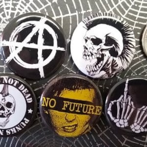 May include: A collection of black and white punk rock buttons with various designs, including a skull, anarchy symbol, and the words "Punks Not Dead" and "No Future". A US quarter is included for size reference.