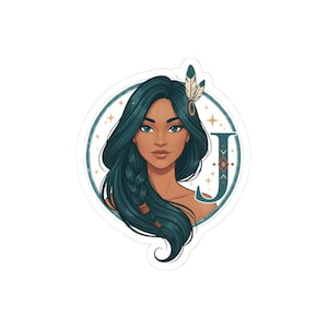 May include: A sticker featuring a portrait of a woman with long teal hair, adorned with a feather and a decorative letter "J". The woman has blue eyes and a warm skin tone, set within a teal circle with star accents.