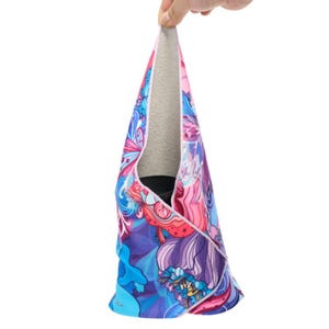 May include: A colorful microfiber towel with a floral pattern in shades of pink, blue, and purple. The towel is folded in half and has a soft, gray lining.