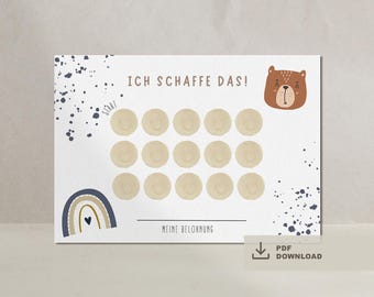 Puede incluir: Un gráfico de recompensas blanco con el texto "ICH SCHAFFE DAS!" y "MEINE BELOHNUNG". Presenta un oso de dibujos animados, un arcoíris y 16 círculos. Se utilizan acentos azul marino y marrón en todo el diseño. Un icono de descarga PDF está en la esquina inferior derecha.