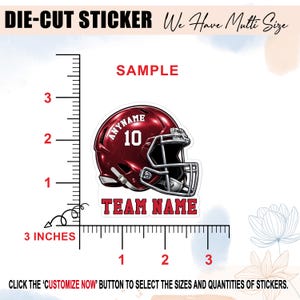 May include: A die-cut sticker featuring a maroon football helmet with a white face mask, the text ANYNAME, the number 10, and the text TEAM NAME. A ruler graphic shows the sticker height and width in centimetres, with text indicating multi-size options.