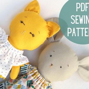 May include: PDF sewing pattern for a yellow cat and a beige bunny stuffed animal. The cat is wearing a white dress with black polka dots and a green skirt. The bunny is wearing a colorful patterned dress.