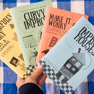 May include: Four instructional quilting booklets titled Wonderfully Wonky Bugs & Flowers, Curvy Improv, Make It Wonky, and Improv Houses. The covers are yellow, light green, orange, and light blue, each featuring black text and graphic illustrations.