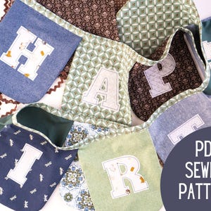 May include: A colourful fabric banner with individual pennants spelling a name. The banner uses various patterned fabrics in blue, green, and brown. Each letter is white with a decorative border. The text "PDF SEWING PATTERN" is in a dark blue circle.