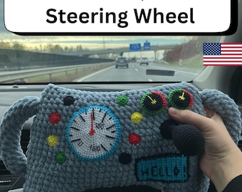 May include: A crocheted steering wheel pattern in shades of gray, blue, and various colors. The design includes a speedometer, buttons, and the word "HELLO". The text "PDF crochet pattern Steering Wheel" is displayed at the top.