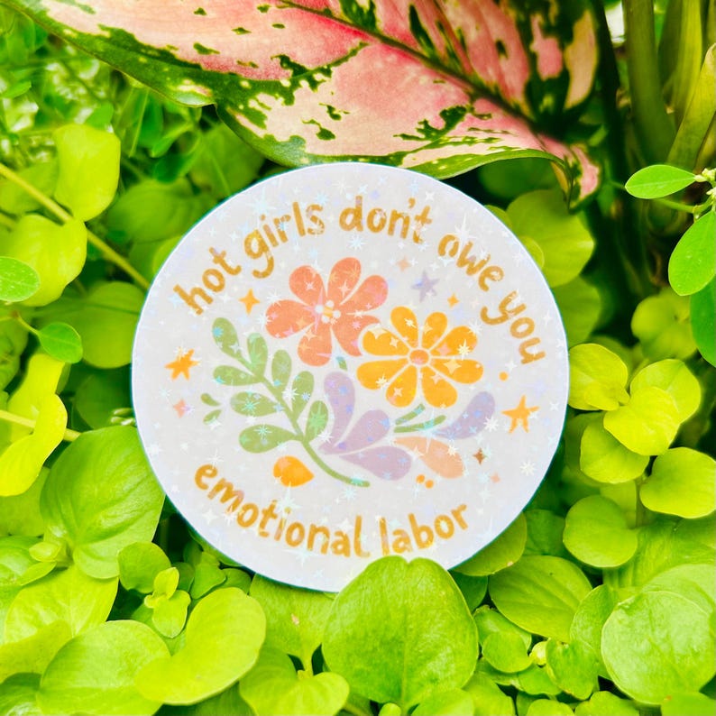 Round “Hot girls don’t owe you emotional labor” sticker displayed among lush green plants. Features retro-inspired floral illustrations in warm pastel tones with a bold feminist boundary-setting message. Ideal mental health, self-care, women’s empowerment, therapy, burnout recovery, and emotional wellness sticker for decorating laptops, water bottles, journals, Kindles, planners, and more.