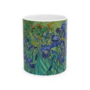 May include: A white ceramic mug with a colorful image of blue irises and green leaves. The image is a reproduction of a famous painting.