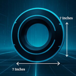 May include: A black circular object with a glowing blue outline, measuring 7 inches in diameter. The object has a central hole and a series of curved cutouts. The background is a dark blue with a grid pattern.