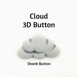 May include: White ceramic cloud-shaped button with a gray outline. The button is a shank button, meaning it has a shank on the back for sewing.