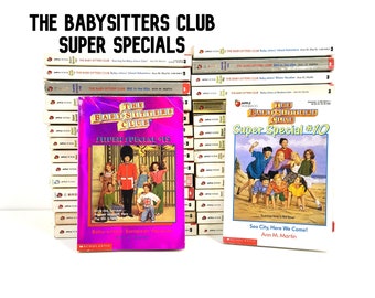 May include: A stack of The Baby-Sitters Club Super Special books. The front cover of two books are visible. The book on the left is Super Special #15, Baby-Sitters European Vacation. The book on the right is Super Special #10, Sea City, Here We Come! by Ann M. Martin.