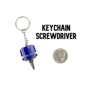 May include: A blue keychain screwdriver with a silver chain and a silver tip. The screwdriver is attached to a silver key ring. The text "KEYCHAIN SCREWDRIVER" is printed on a white background.