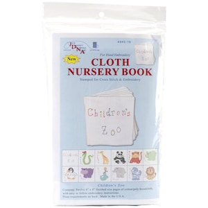 May include: A cloth nursery book kit for hand embroidery, packaged in clear plastic. The kit includes twelve 8" x 8" pages of cotton/poly broadcloth, stamped for cross stitch and embroidery. The cover features the text "Children's Zoo" and illustrations of zoo animals.
