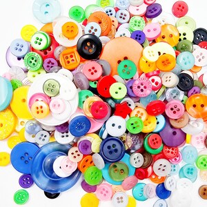 May include: A large assortment of colorful buttons in various shapes and sizes. The buttons are made of plastic and metal and feature a variety of designs, including polka dots, stripes, and floral patterns.