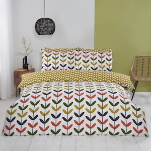 May include: A white duvet cover with a repeating pattern of stylised green, orange, and yellow leaves on a white background. The duvet cover is on a bed with two matching pillowcases.