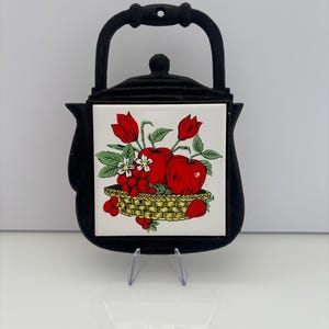 Vintage gjutjärns tekannaunderlägg med keramiska plattor