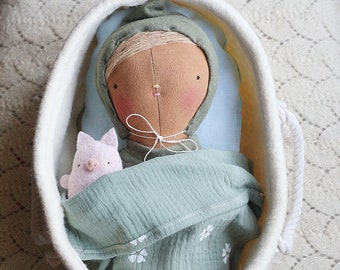 baby doll, baby in a crib cloth doll, doll kit with accessories,pyjama,swaddle blanket,tiny plush, wool basket, sage green