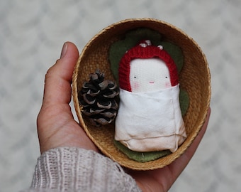 holiday mini baby doll, swaddled baby, in a vintage basket, mushroom bonnet, wool leaf, natural pine cone, mushroom inspired mini doll