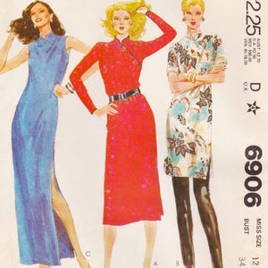 May include: Three vintage dresses are featured in this image. The dresses are in blue, red, and floral patterns. The red dress has a black belt. The image also includes the number 6906 and other text.