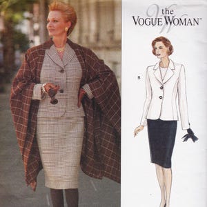 May include: A sewing pattern envelope titled The Vogue Woman featuring two garment designs. Design A shows a plaid skirt suit with a matching brown plaid cape. Design B is an illustration of a solid white blazer with two buttons and a black skirt.