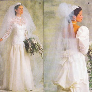 May include: Two white wedding dresses. One features a high-neck lace bodice, long sleeves, and a flowing skirt. The other has a puffy sleeve design, a veil, and a floral bouquet. Both dresses are classic bridal styles.
