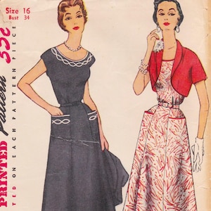May include: Vintage sewing pattern featuring two women modeling dresses. One woman wears a dark dress with white trim and pockets. The other wears a red bolero over a patterned dress. The pattern is size 16, bust 34.
