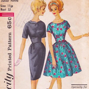 May include: Vintage sewing pattern featuring two illustrated women in dresses. One woman wears a dark blue dress with a bow detail, the other a teal dress with a floral pattern. The pattern is labeled "Junior Petite" with a bust size of 33 inches.
