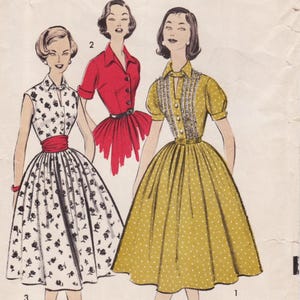 May include: A vintage sewing pattern illustration featuring three dress designs. One is a white sleeveless dress with black floral prints and a red sash. Another is a red short-sleeved dress with a belt. The third is a mustard yellow polka-dot dress.