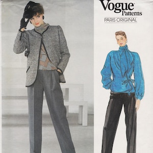 May include: A Vogue Patterns Paris Original sewing pattern envelope featuring two outfits: a grey tweed jacket with black trim, a patterned turtleneck, and grey pinstripe trousers, alongside a bright blue long-sleeve blouse and black trousers.