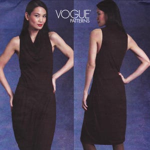 May include: A sleeveless dark brown dress with a cowl neckline and a draped skirt design. The garment is displayed from both the front and back views. The text VOGUE PATTERNS is printed in white at the top center of the image.