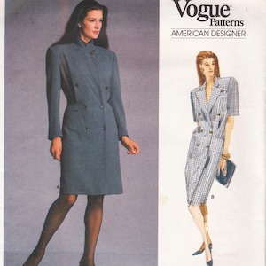 May include: Vogue Patterns American Designer dressmaking pattern. The image shows two dress designs. One is a long, double-breasted, grey dress with a high collar. The other is a short-sleeved, double-breasted dress with a plaid pattern.