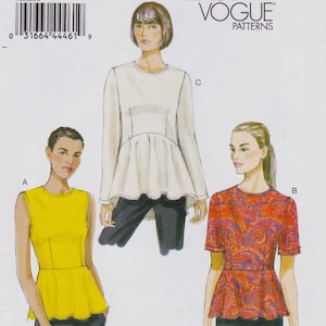 May include: Vogue Patterns sewing pattern featuring three different women's tops. The tops include a sleeveless yellow top, a long-sleeved white top, and a short-sleeved red paisley top. The Vogue Patterns logo is visible in the upper right corner.