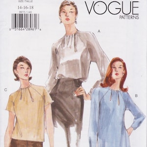 May include: A Vogue Patterns sewing pattern envelope featuring illustrations of three variations of a blouse. The designs include a short-sleeved yellow top, a long-sleeved light gray blouse with a dark skirt, and a long-sleeved light blue tunic.
