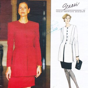 May include: A woman in a red suit with a matching skirt. The suit has a round neckline and button closures. The image also includes a Vogue American Designer pattern by Scaasi, featuring a white jacket and black skirt.