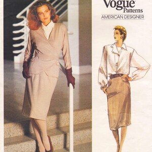 May include: A woman in a light brown wrap-style suit with a matching skirt, brown gloves, and shoes. The image is from a Vogue Patterns advertisement, with the text "Vogue Patterns AMERICAN DESIGNER" at the top.