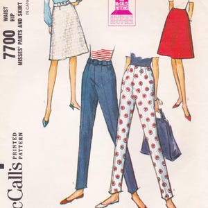 May include: Vintage McCall's sewing pattern featuring illustrations of women's pants and skirts. The pattern includes designs for high-waisted pants, a white skirt, and a red skirt. The pattern's text includes "7700" and "Misses' Pants and Skirt".